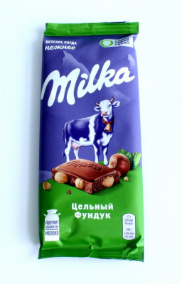 Плитка "Milka" Цельный фундук, молочный шоколад, 85гр 771140